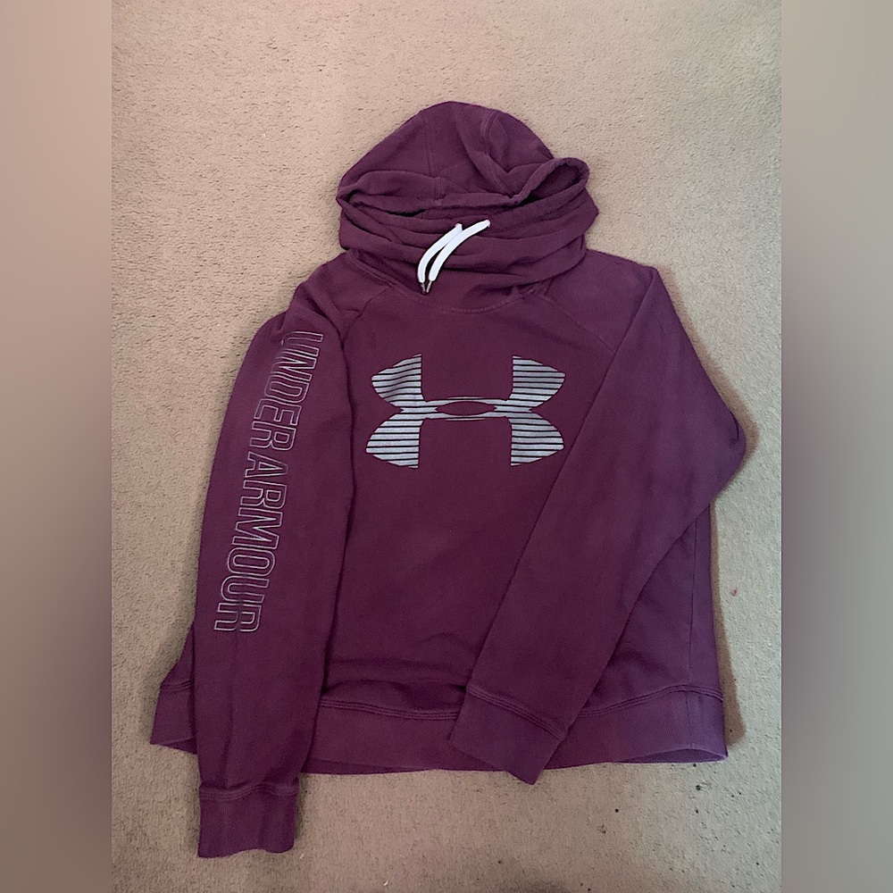 Purple Under Armour hoodie with silver reflective graphic design.